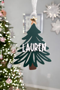 Close-up of personalized acrylic Christmas tree ornament | Buffy + Coco
